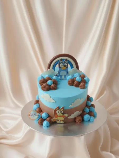 Bluey and Bingo Themed Cake with Clouds and Rainbow